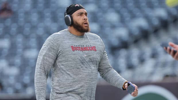 Aug 19, 2023; East Rutherford, New Jersey, USA; Tampa Bay Buccaneers guard Aaron Stinnie (64) warms up before the game against the New York Jets at MetLife Stadium.